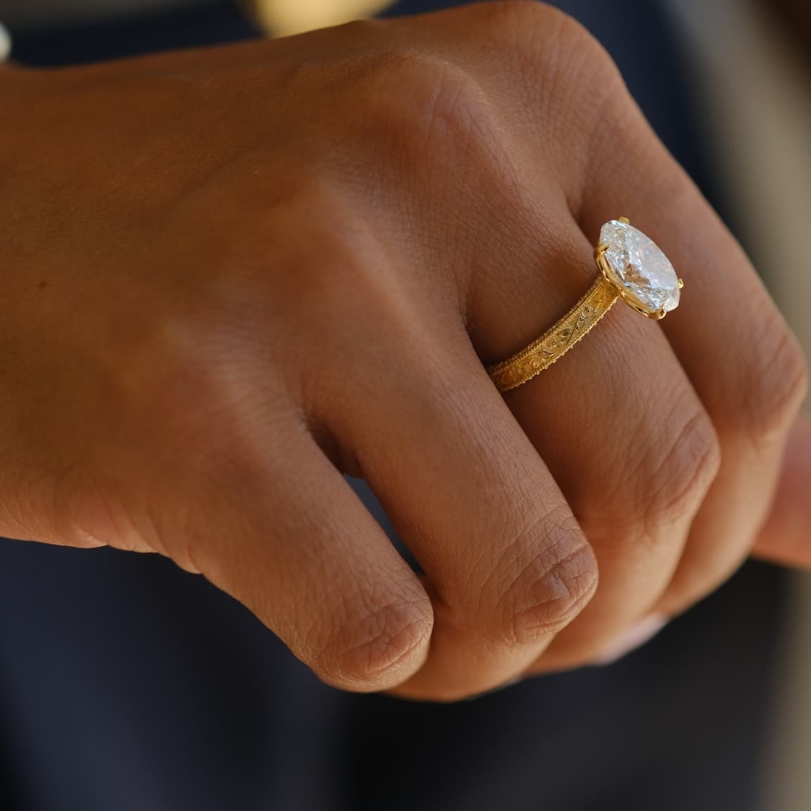 Marquise solitaire, engraved yellow gold band